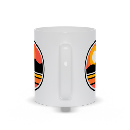 outdoor coffee mug - a sun setting over an island landscape coffee mug