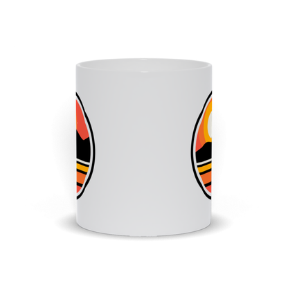 outdoor coffee mug - a sun setting over an island landscape coffee mug